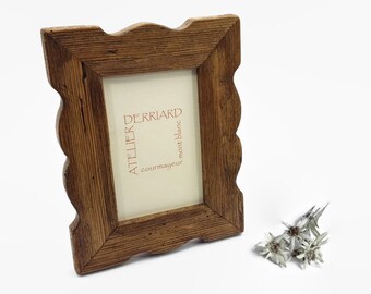 shaped photo frame in old wood, table or wall