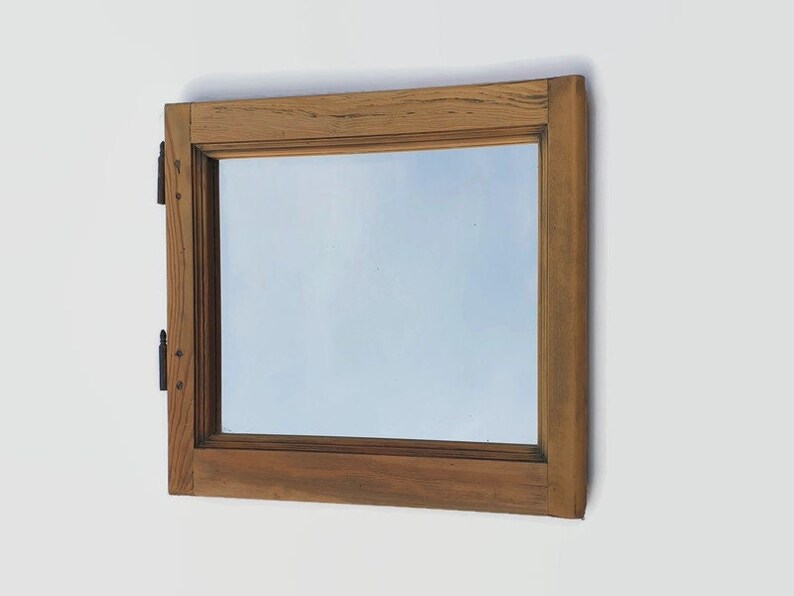 Shops framed wall mirror made with an old wooden window