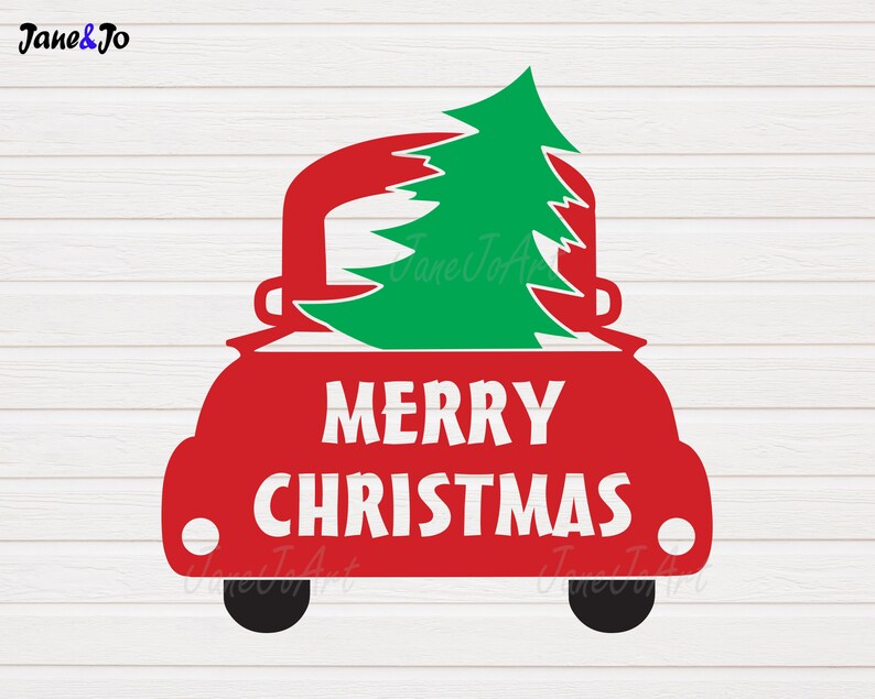 May include: A red truck silhouette with a green Christmas tree in the bed. The words "MERRY CHRISTMAS" are in white block letters on the truck's side. The image is set against a white wood-grain background.
