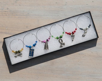 Dr Who  wine glass charms, six different charms a TARDIS, dalek, Converse shoe, scarf, bow tie and sunglasses.