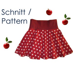Könnte beinhalten: Ein roter Rock mit weißem Sternenmuster und einem dunkelblau-roten gestreiften Bund. Der Text "Schnitt / Pattern" ist in der oberen linken Ecke zu sehen, und drei rote Äpfel mit grünen Blättern sind um den Rock herum angeordnet.