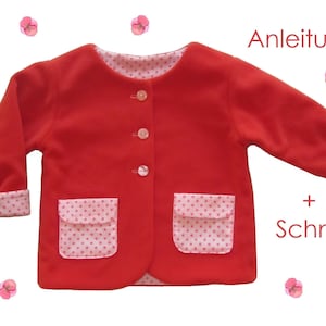 May include: Red fleece jacket with pink polka dot trim on the cuffs, collar, and pockets. The jacket has a button closure and the text "Anleitung + Schnitt" is visible on the right side of the image.