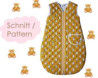 May include: A sleeveless quilted sleeping bag in mustard yellow featuring a repeating pattern of white bears and small trees. The garment has a central vertical zipper, white trim, and a single patch pocket on the front. Text reads: Schnitt / Pattern.