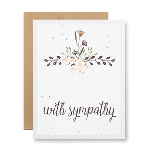 May include: A sympathy card with a floral design and the text "with sympathy" in brown script.