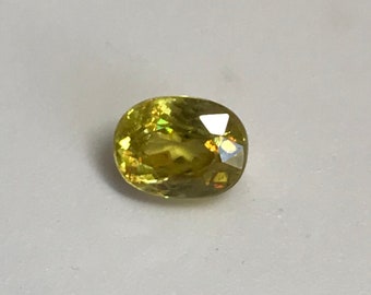 1 ct Yellow Green Sphene with Rainbow Fire 7.2x5.3mm Oval Cut 