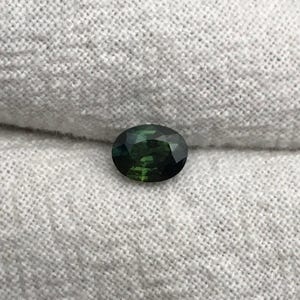 0.67 carat Natural Green Sapphire Oval Approx. 5x4.5mm image 1