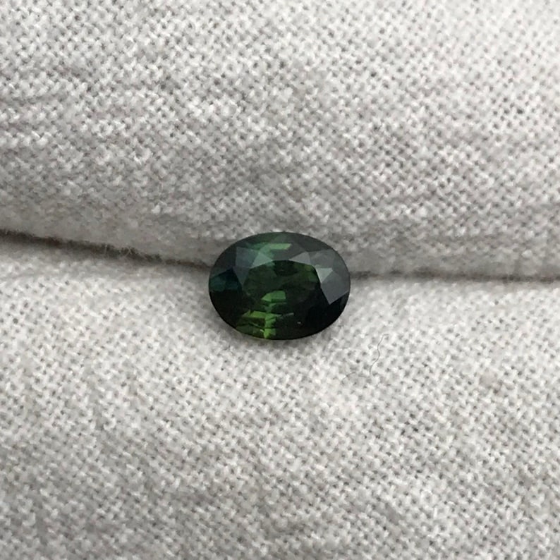 0.67 carat Natural Green Sapphire Oval Approx. 5x4.5mm image 1