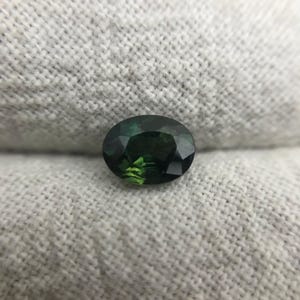 0.67 carat Natural Green Sapphire Oval Approx. 5x4.5mm image 5