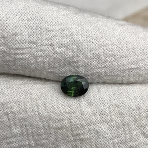 0.67 carat Natural Green Sapphire Oval Approx. 5x4.5mm image 7