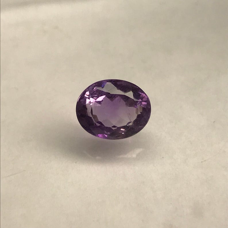 6,51 karat lila ametist 12,5 x 10 mm oval slipning, lös fasetterad födelsesten bild 9