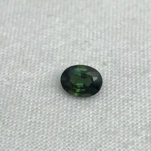 0.67 carat Natural Green Sapphire Oval Approx. 5x4.5mm image 4