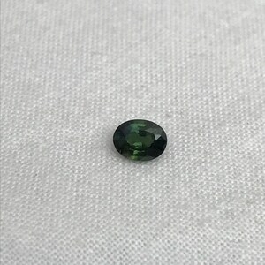 0.67 carat Natural Green Sapphire Oval Approx. 5x4.5mm image 6