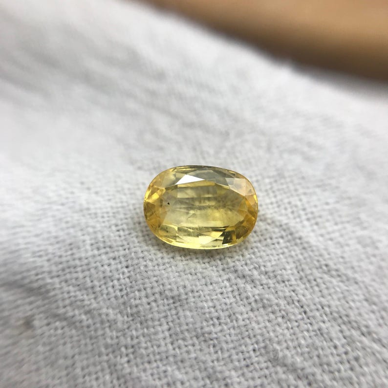 Naturlig gul safir 1,34 karat 7,5x5,5 mm oval slipning, färgbehandlad ädelsten, jordbrytning, BE-värme bild 5