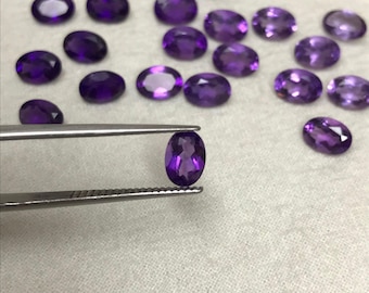 EN - 7 x 5 mm ametist oval slipad, fasetterad lös omonterad ädelsten, mellan till mörklila