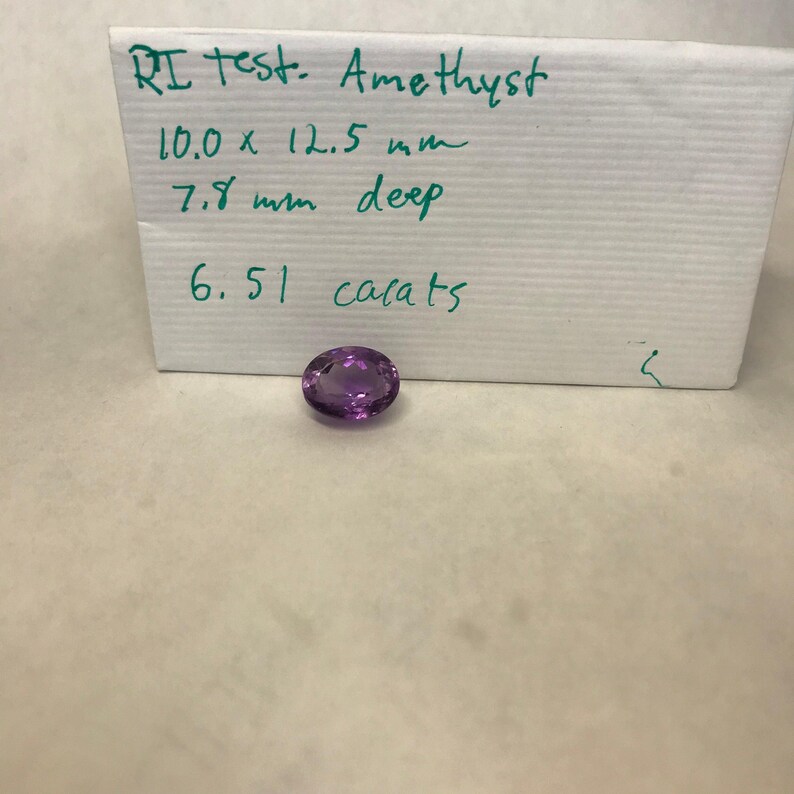 6,51 karat lila ametist 12,5 x 10 mm oval slipning, lös fasetterad födelsesten bild 10