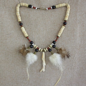 Vintage craftsman (woman) hand made feather and shell necklace