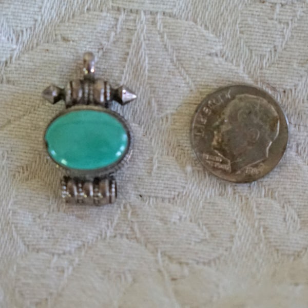 Vintage Turkmen silver pendant with turquoise stone