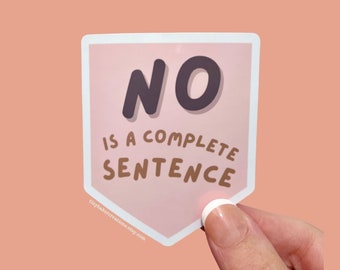 May include: A sticker with a pink background and white border. The sticker has the word "NO" in dark gray, with the phrase "IS A COMPLETE SENTENCE" below it in brown. The sticker is held by a person's hand.