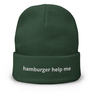 May include: A dark green beanie with the text "hamburger help me" embroidered in white on the front.