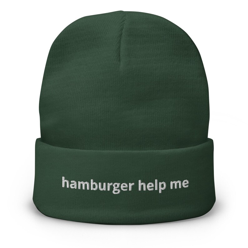 May include: A dark green beanie with the text "hamburger help me" embroidered in white on the front.