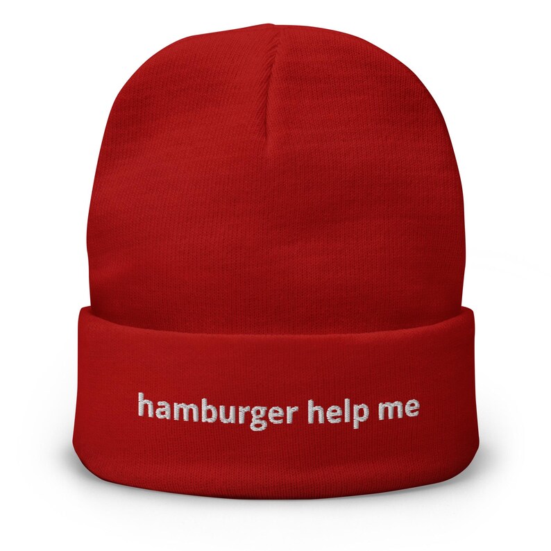May include: Red beanie with the text "hamburger help me" embroidered in white on the cuff.