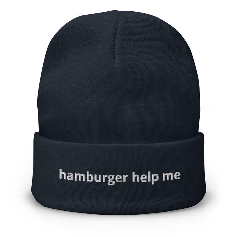 May include: A navy blue beanie with the text "hamburger help me" embroidered in white on the front.