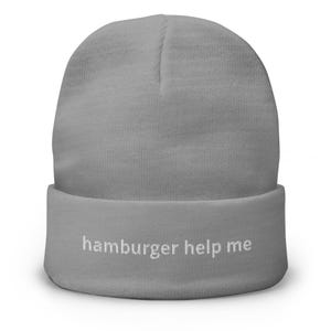 May include: Gray beanie with the text "hamburger help me" embroidered in white on the cuff.
