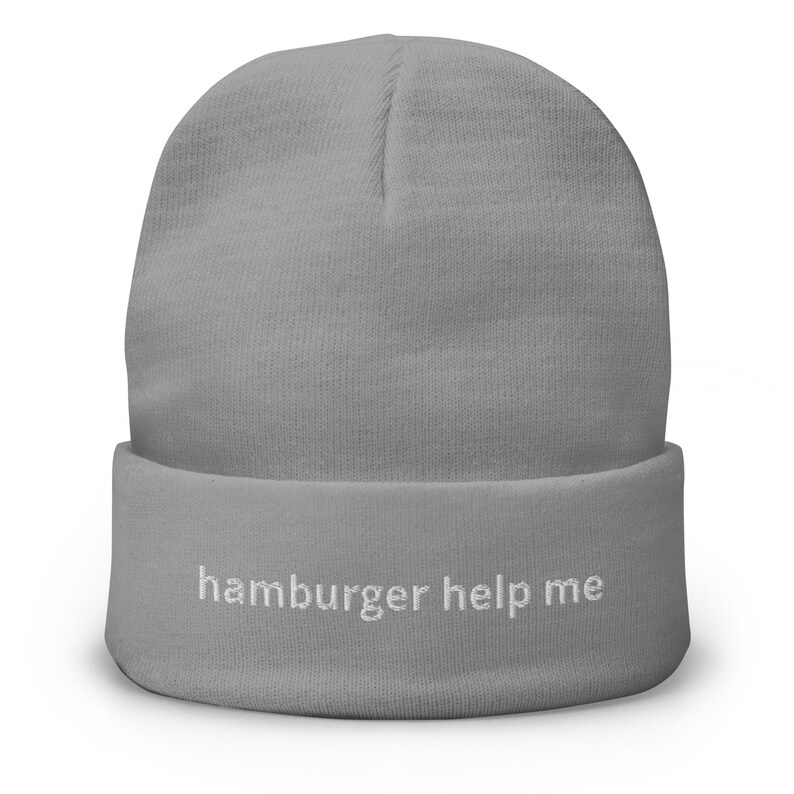 May include: Gray beanie with the text "hamburger help me" embroidered in white on the cuff.