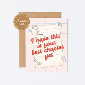 May include: A greeting card with a pink grid background and the text "I hope this is your best chapter yet" in red. The card has a library card design with floral accents and is accompanied by a brown envelope.