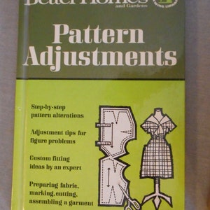 May include: A book titled "Better Homes and Gardens Pattern Adjustments" with a green and white cover. The cover features text and illustrations related to sewing and pattern alterations. The book is part of the Creative Sewing Library.