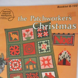 May include: A vintage book titled "The Patchworker's Christmas" with a colorful patchwork quilt design on the cover. The book includes full-size templates and step-by-step instructions for machine and hand sewing.