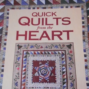 May include: Book cover with the title "Quick Quilts from the Heart" by Liz Porter and Marianne Fons. The cover features a colorful quilt with a star design.