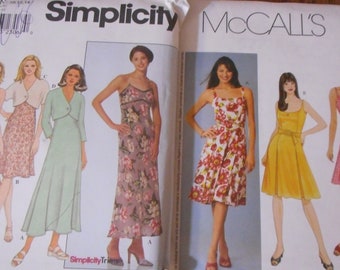 May include: A sewing pattern for a dress with a variety of styles. The pattern includes a long floral dress, a shorter floral dress, a green dress with a wrap top, and a yellow dress with a sash. The pattern is for sizes 6-8-10.