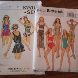 May include: Two sewing pattern envelopes for swimwear. The envelope on the left is for Kwik-Sew pattern #1400 and features four women wearing different styles of swimsuits. The envelope on the right is for Butterick pattern #B4526 and features five women wearing different styles of swimsuits.