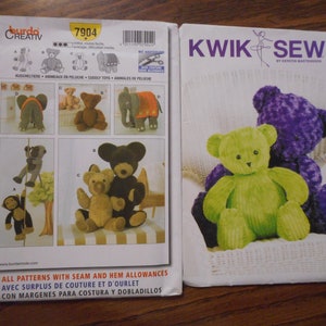 May include: Two sewing patterns for stuffed animal toys. The pattern on the left is for a variety of animals including an elephant, bear, and monkey. The pattern on the right is for a bear with two different sizes, small and large. The pattern on the right has the text "Kwik Sew K3246 Bear Sizes: Small & Large" printed on it.