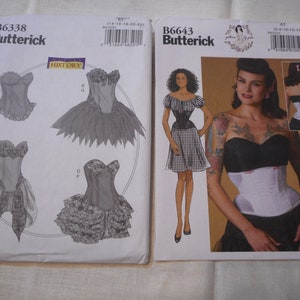 May include: Two sewing patterns for corsets. The pattern on the left is for a historical corset with a variety of skirt options. The pattern on the right is for a modern corset with a black and white gingham skirt. Both patterns are from Butterick.
