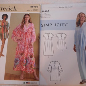 May include: Two sewing pattern envelopes, one for a long, flowing dress with a V-neck and long sleeves, and the other for a dress with a round neck and short sleeves. The patterns are from Butterick and Simplicity.