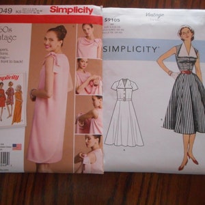 May include: Two vintage Simplicity sewing patterns for dresses. The pattern on the left is for a 1960s vintage wrap dress and is labelled 8049. The pattern on the right is for a vintage dress with a collar and is labelled 59105.