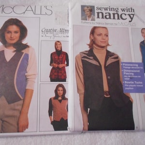 May include: A sewing pattern for a vest in a blue, white and black colour scheme. The pattern is from McCall's and is designed by Nancy Zieman. The pattern number is 8985.