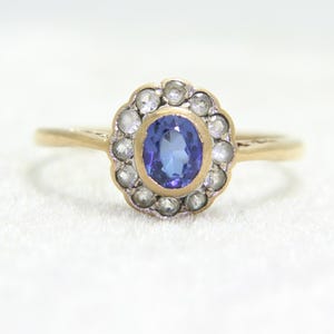 May include: A white ceramic mug with a black handle and the text "But First, Coffee" in a black, handwritten-style font. The mug sits on a white surface.