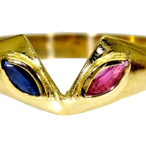 May include: A gold ring with a V-shaped design. The ring has two oval gemstones, one blue and one pink, set in a polished gold band. The gemstones are at the ends of the V, creating a symmetrical appearance.