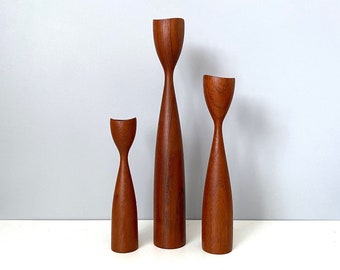 Three teak tulip candlesticks made in Denmark - varied heights