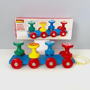 May include: A set of three ceramic mugs with a speckled, matte finish. The mugs are in shades of cream, light gray, and dark gray. Each mug has a simple, minimalist design, perfect for coffee or tea.