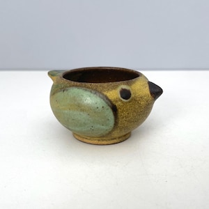 May include: A rustic wooden sign with the text "Welcome to our home" in white lettering. The sign features a distressed finish and a simple, inviting design, perfect for front door decor.