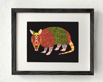 May include: A colorful illustration of an armadillo on a black background. The armadillo is brown, green, yellow, and pink. The armadillo is facing the left side of the image.