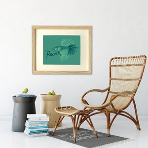 May include: A framed print with a teal background featuring a stylized illustration of a fish with the word "Pisces" in dark blue lettering.