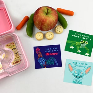 May include: Three colorful cards with inspirational messages and illustrations of a rooster, a frog, and a fennec fox. The text on the cards reads "You can be scared and brave", "Stick with it you'll get it", and "Believe in yourself".