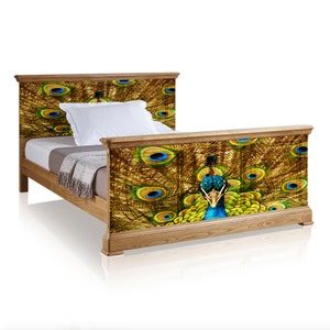 May include: A wooden bed frame featuring a peacock design. The headboard and footboard are adorned with a colourful peacock feather pattern in shades of blue, green, and gold.
