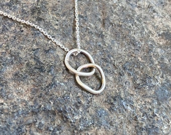Silver necklace with ring pendant