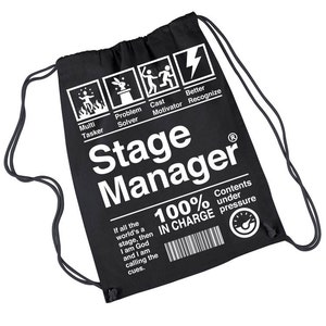 May include: Black drawstring bag with white text and graphics. The bag reads "Stage Manager" and includes icons for "Multi Tasker," "Problem Solver," "Cast Motivator," and "Better Recognize." The bag also states "100% IN CHARGE."